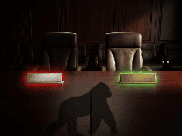 Boardroom desk split with CEO nameplate and COO nameplate, gorilla shadow cast across