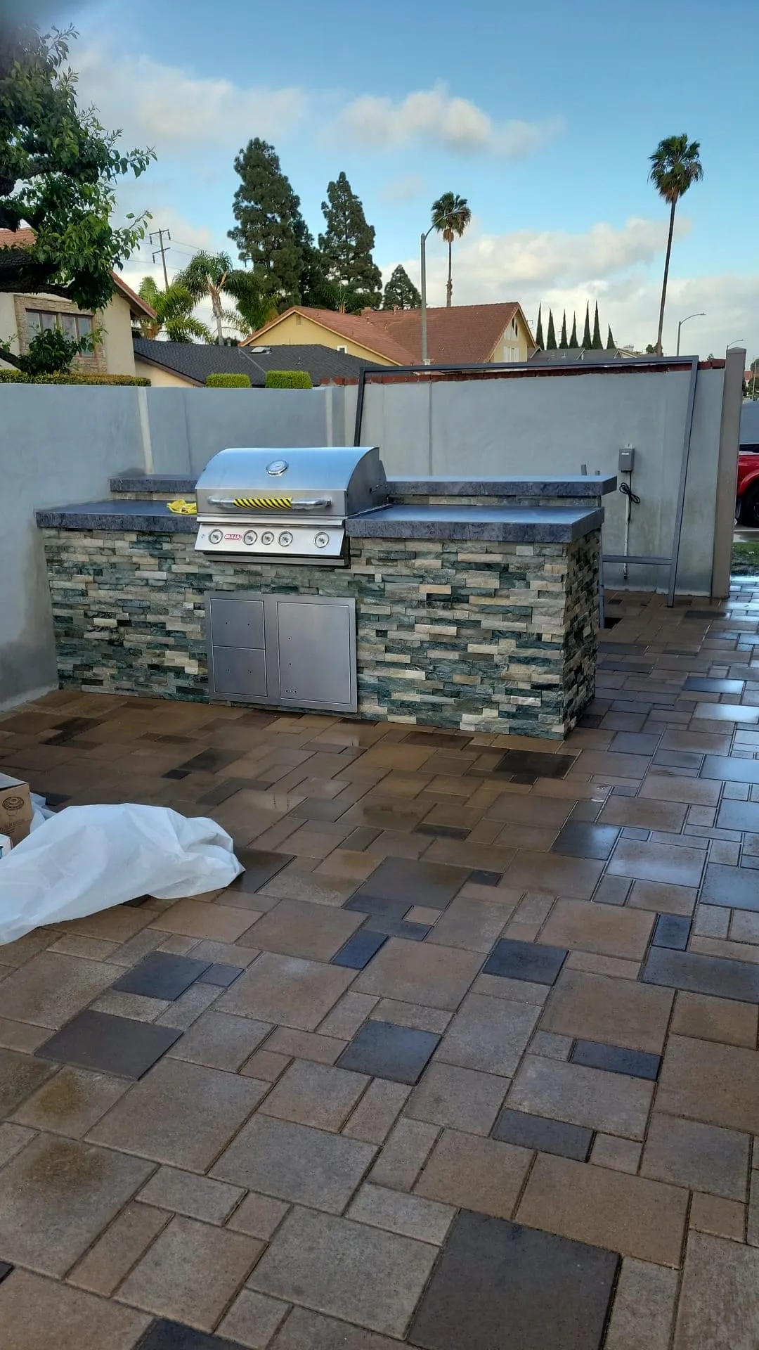 Teal Ledger Stone Island on Pavers โ After